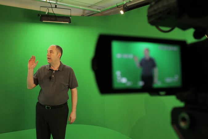 man in green screen room