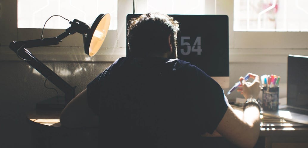 Man at desk remote learning
