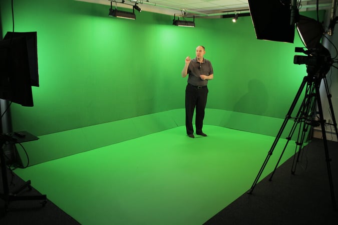man in green screen room