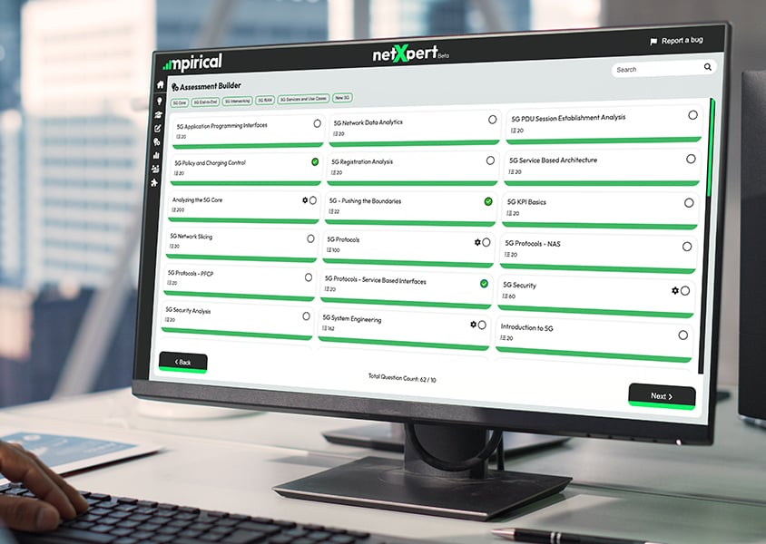 NetXpert Quiz Builder on laptop as man inputs content