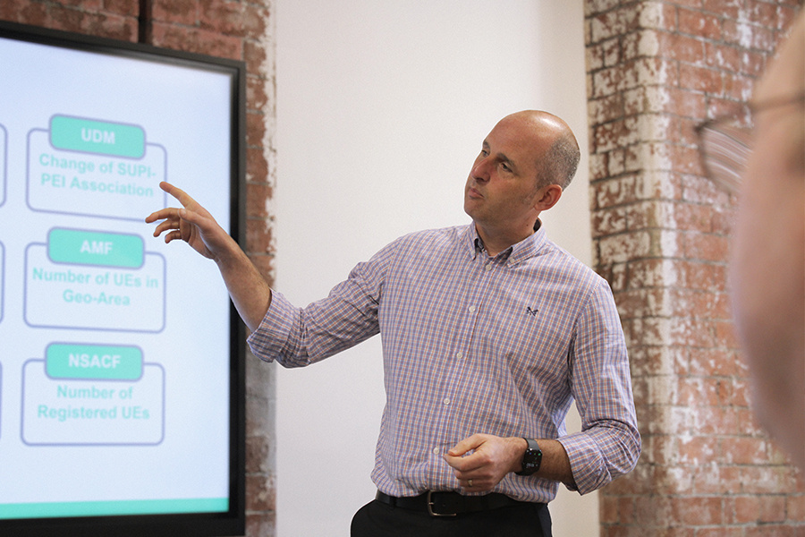 Mpirical trainier delivering telecoms training during a live onsite session