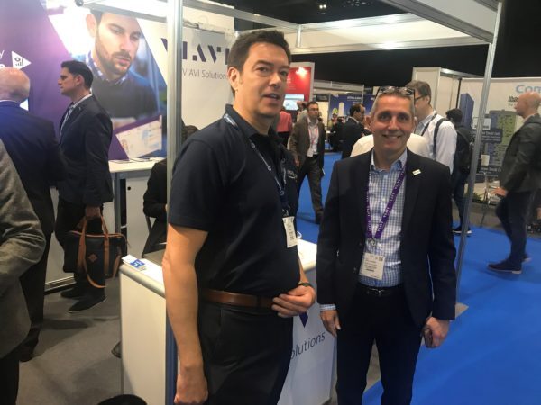 two men posing for a photograph at 5G World ExCel London