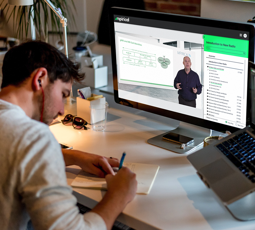 Man watching Mpirical video training while taking notes