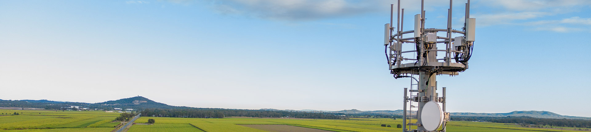 Glossary header - telecoms antenna at height over fields