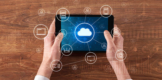 person holding tablet with cloud image displayed