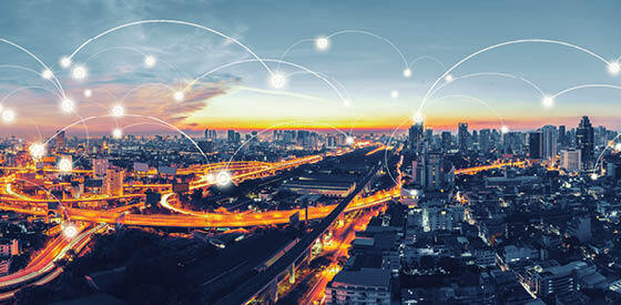 smart city future world with illustrative wireless connections above skyline