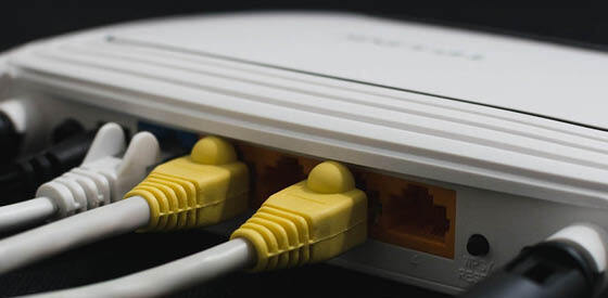ethernet cable plugged into back of router