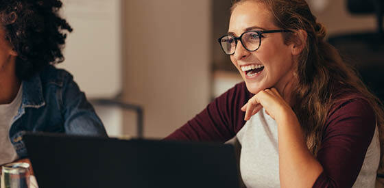 girl with glasses laughing