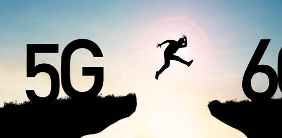 silhouette of person leaping from one cliff symbolizing 5G to another cliff symbolizing 6G