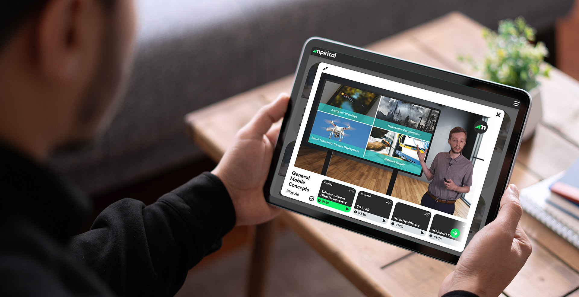 A user watching Telecoms Bytes on tablet device