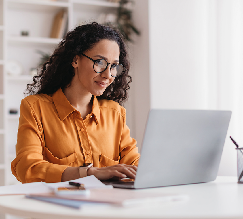 Woman watching Mpirical training videos on her laptop